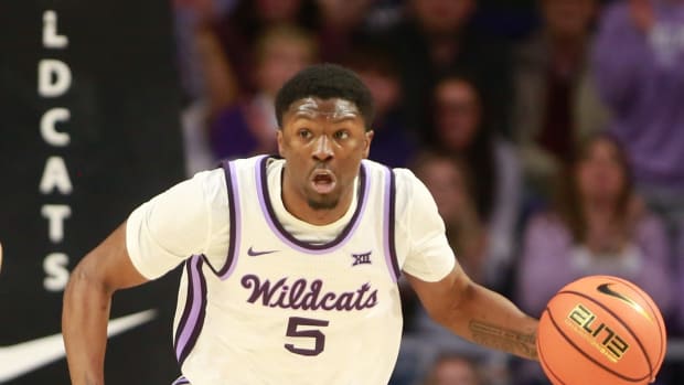 Kansas State junior guard Cam Carter (5) dribbles back a Kansas rebound in the first half of the Sunflower Showdown inside Bramlage Coliseum Monday, February 5, 2024.